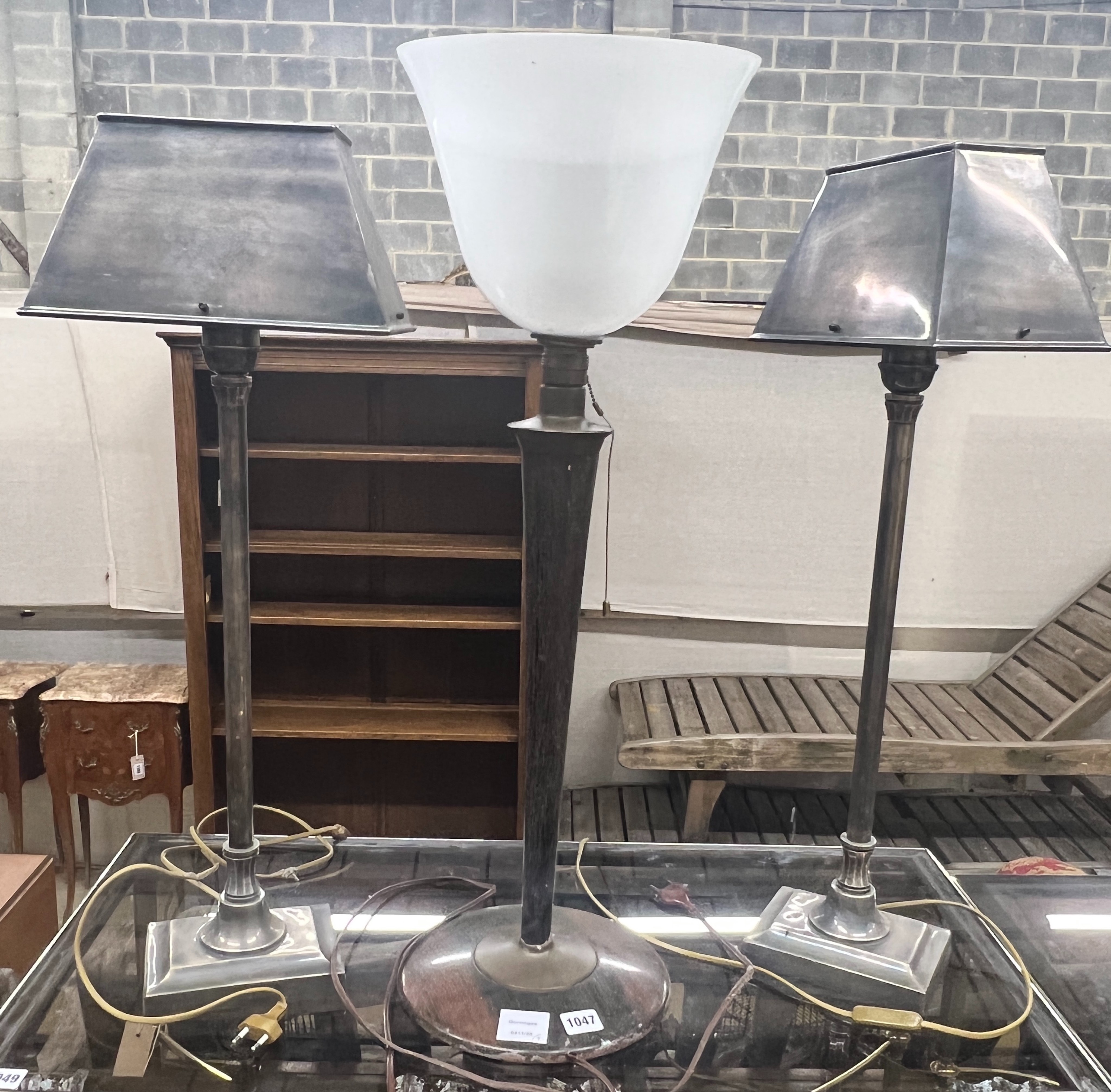A pair of plated metal table lamps, height 71cm together with a mid century simulated rosewood lamp with opaque glass shade